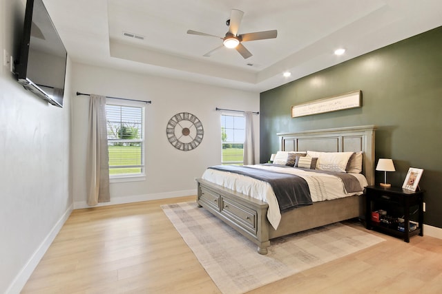7495 N Rte Z, Columbia, MO 65202 - bedroom featuring a tray ceiling, recessed lighting, light wood-style flooring, baseboards, and visible vents