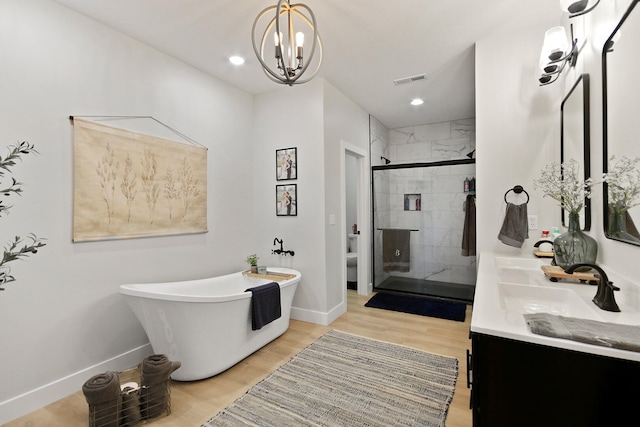 7495 N Rte Z, Columbia, MO 65202 - full bath featuring visible vents, a shower stall, a notable chandelier, a freestanding bath, and baseboards