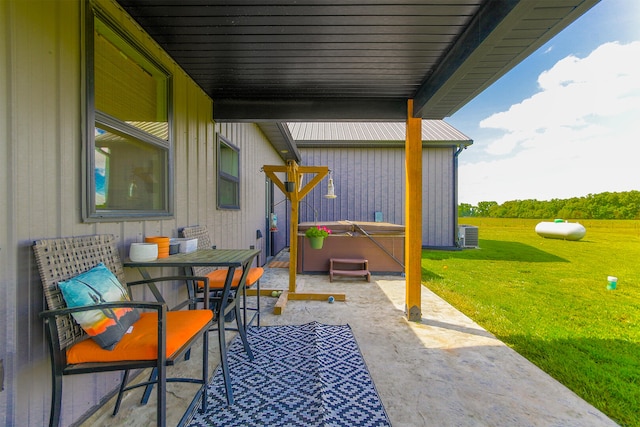 7495 N Rte Z, Columbia, MO 65202 - view of patio featuring a hot tub, outdoor dining area, and central air condition unit