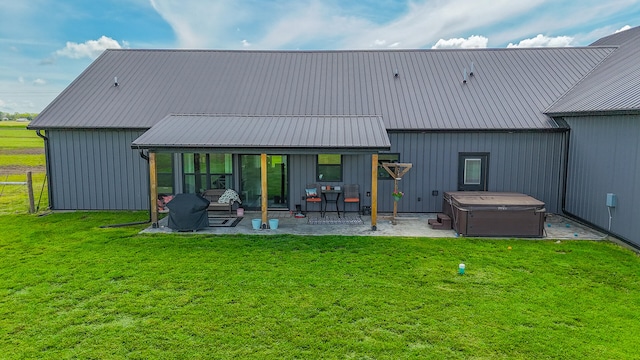 7495 N Rte Z, Columbia, MO 65202 - back of house with a lawn, metal roof, a patio, and a hot tub
