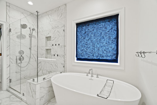 bathroom with marble finish floors, a marble finish shower, a soaking tub, and recessed lighting
