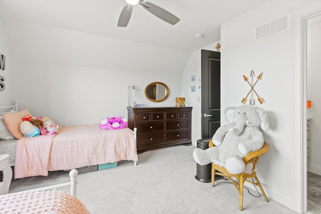 bedroom featuring carpet flooring, vaulted ceiling, and a ceiling fan
