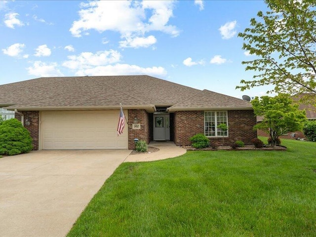 ranch-style home featuring brick siding, a garage, concrete driveway, roof with shingles, and a front lawn