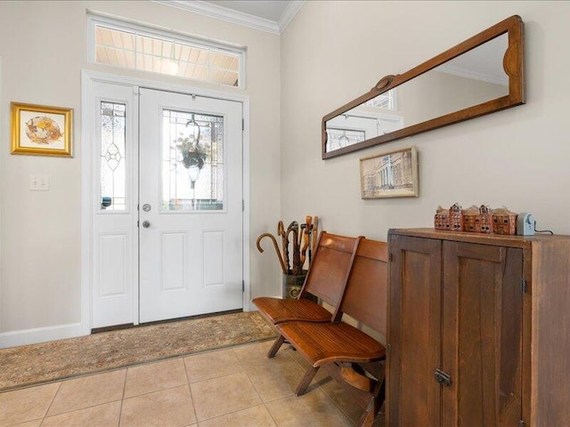 foyer featuring ornamental molding, baseboards, and light tile patterned floors