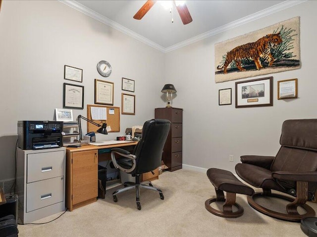 office featuring a ceiling fan, ornamental molding, light colored carpet, and baseboards