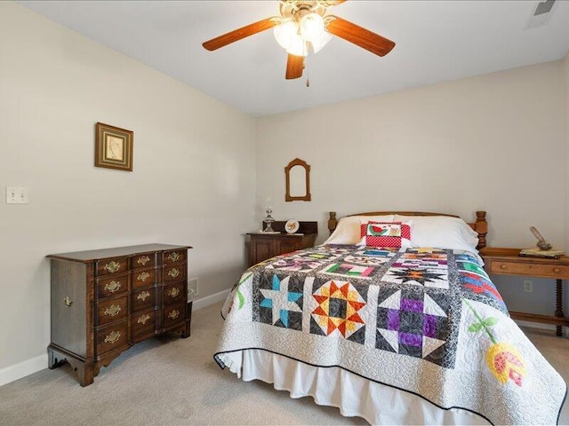 carpeted bedroom with baseboards and a ceiling fan