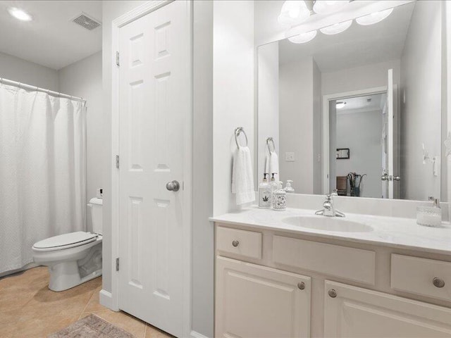 bathroom with toilet, tile patterned floors, vanity, and visible vents