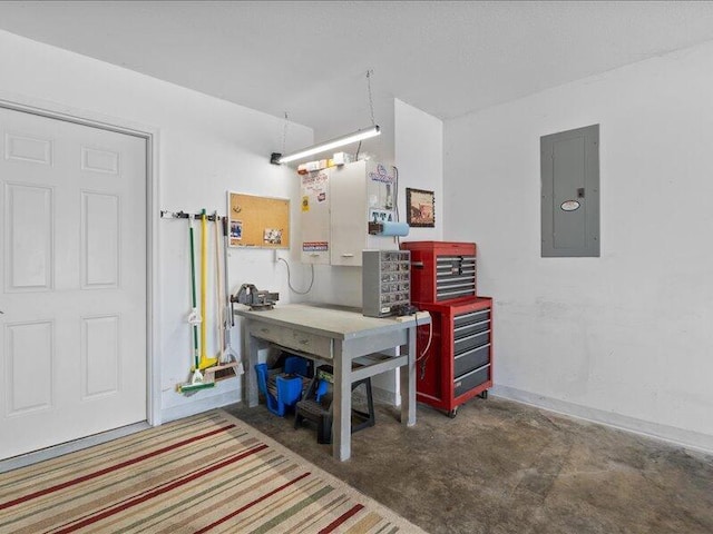 garage featuring a workshop area and electric panel