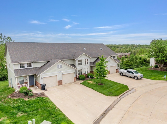 view of front of home with a garage, concrete driveway, a front yard, a porch, and roof with shingles