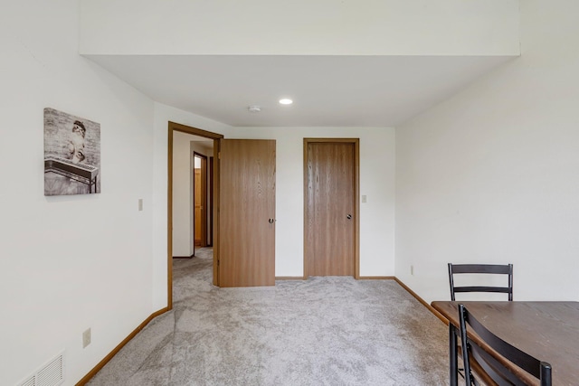 unfurnished dining area with baseboards, recessed lighting, visible vents, and carpet