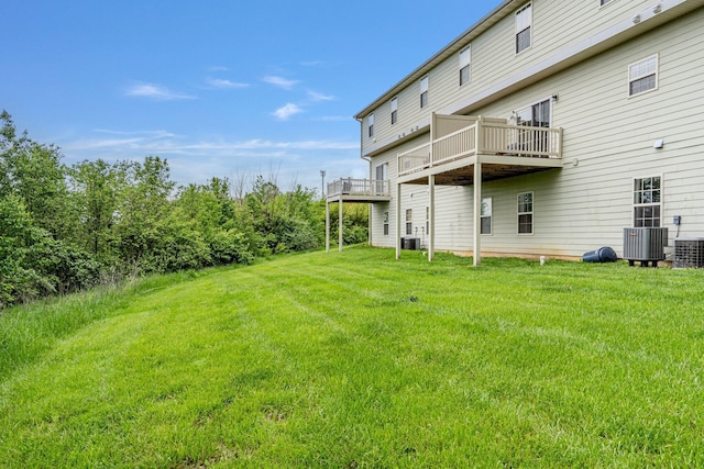 view of yard featuring a deck and cooling unit