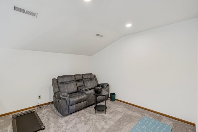 living area with baseboards, carpet flooring, visible vents, and vaulted ceiling