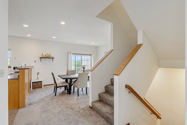 dining area featuring stairs, light carpet, and recessed lighting