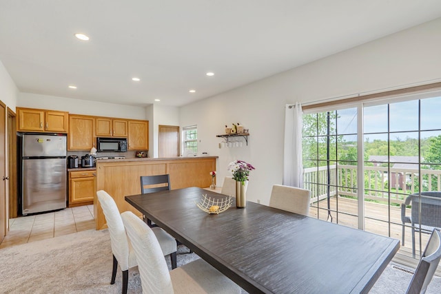 dining room with light tile patterned floors and recessed lighting
