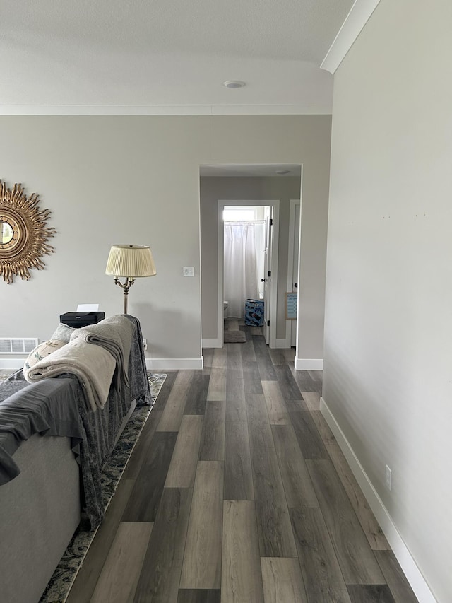 1001 Shore Acres Loop, Columbia, MO 65201 - hallway featuring crown molding, baseboards, and dark wood-type flooring