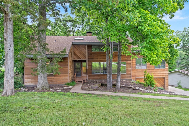 2036 Wendemere Ct, Jefferson City, MO 65109 - rustic home featuring a shingled roof, a front lawn, a chimney, and an attached garage