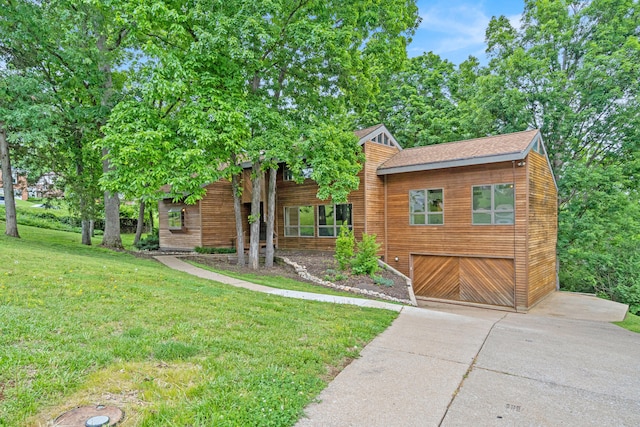 2036 Wendemere Ct, Jefferson City, MO 65109 - view of front of property featuring concrete driveway, an attached garage, a front yard, and roof with shingles