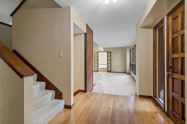 2036 Wendemere Ct, Jefferson City, MO 65109 - entrance foyer featuring stairway, light wood-type flooring, and baseboards
