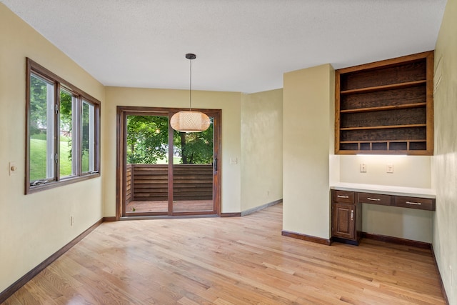 2036 Wendemere Ct, Jefferson City, MO 65109 - unfurnished dining area with light wood finished floors and baseboards