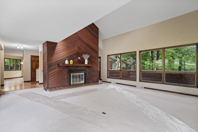 2036 Wendemere Ct, Jefferson City, MO 65109 - unfurnished living room with carpet flooring, a large fireplace, and baseboards