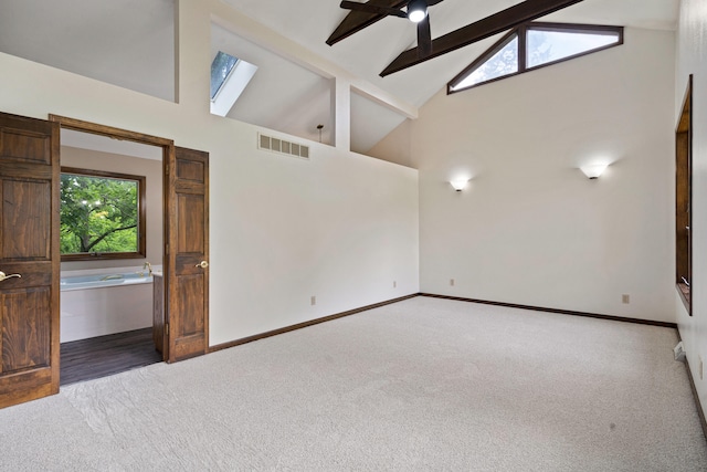 2036 Wendemere Ct, Jefferson City, MO 65109 - unfurnished room with high vaulted ceiling, carpet floors, beam ceiling, and baseboards