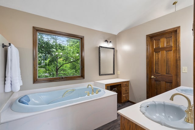 2036 Wendemere Ct, Jefferson City, MO 65109 - bathroom featuring vanity, a bath, and lofted ceiling