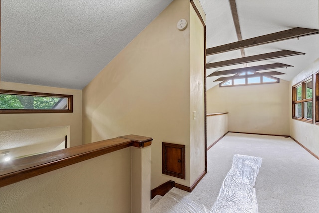 2036 Wendemere Ct, Jefferson City, MO 65109 - hallway featuring carpet floors, an upstairs landing, a textured ceiling, and baseboards