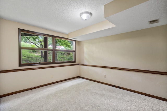 2036 Wendemere Ct, Jefferson City, MO 65109 - carpeted spare room with a textured ceiling and baseboards