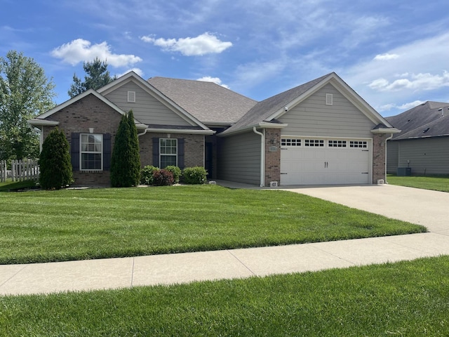 ranch-style home featuring brick siding, an attached garage, a front lawn, driveway, and central air condition unit