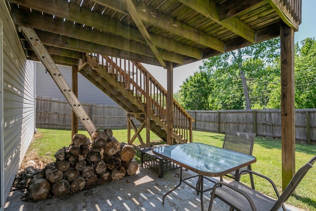 view of patio with stairs and outdoor dining area