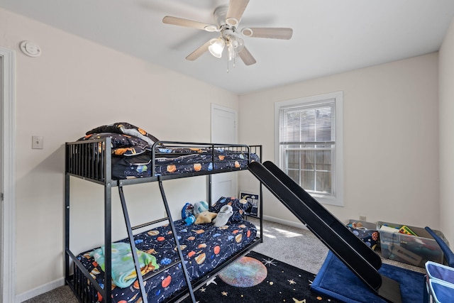 bedroom with carpet floors, ceiling fan, and baseboards