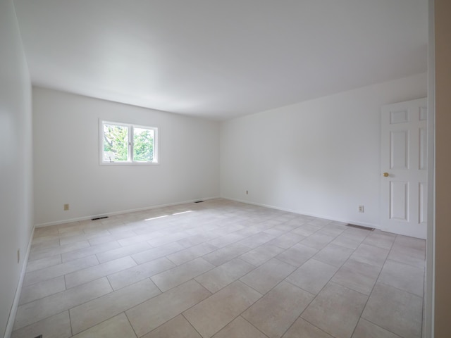 empty room featuring baseboards
