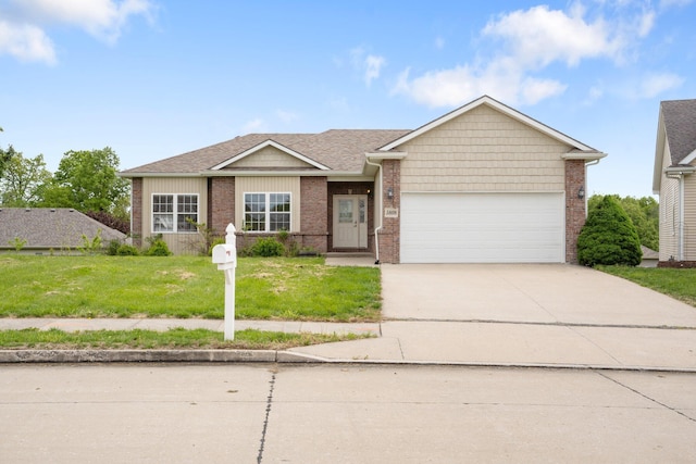 single story home featuring a front lawn, driveway, a garage, and brick siding