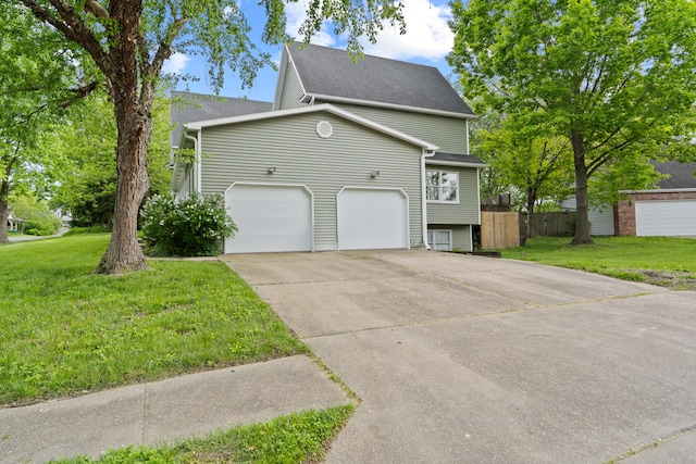 view of side of home featuring driveway and a shingled roof