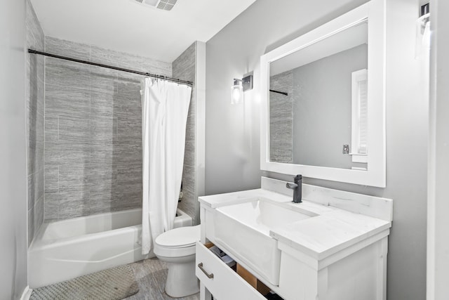 bathroom featuring toilet, vanity, and shower / bathtub combination with curtain