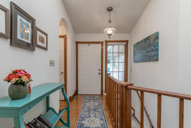 2105 Oak Point Ct, Columbia, MO 65203 - entryway with light wood finished floors, arched walkways, and baseboards