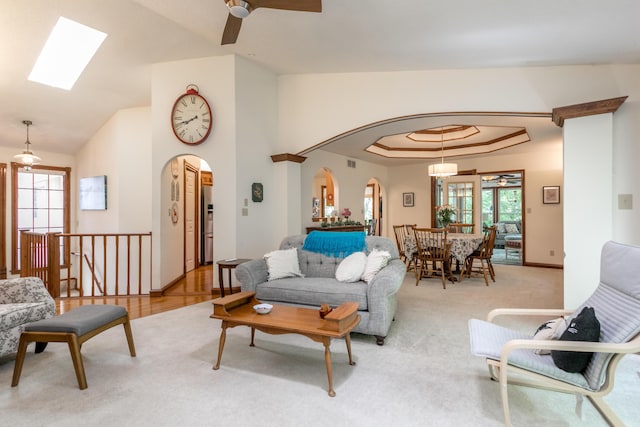 2105 Oak Point Ct, Columbia, MO 65203 - living area featuring arched walkways, ceiling fan, plenty of natural light, and vaulted ceiling