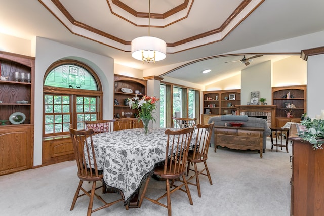 2105 Oak Point Ct, Columbia, MO 65203 - dining room with ornamental molding, light colored carpet, a raised ceiling, ceiling fan, and vaulted ceiling