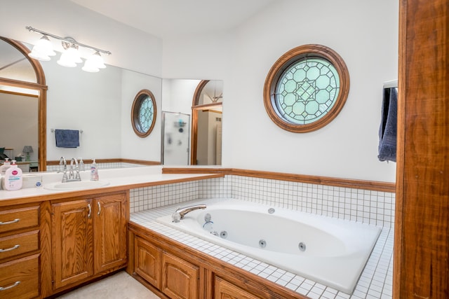 2105 Oak Point Ct, Columbia, MO 65203 - full bathroom featuring a tub with jets, a shower stall, and vanity