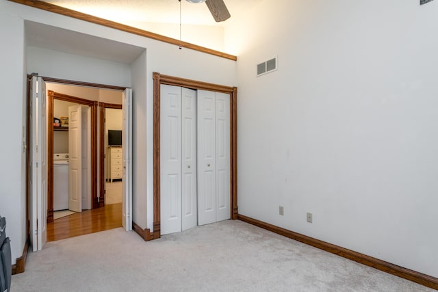 2105 Oak Point Ct, Columbia, MO 65203 - unfurnished bedroom with carpet flooring, a closet, baseboards, and washer / clothes dryer