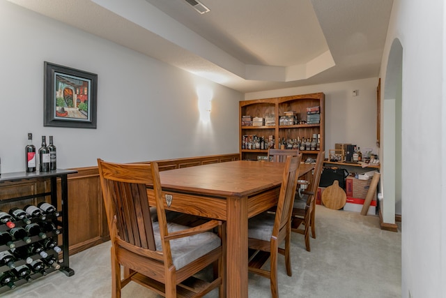 2105 Oak Point Ct, Columbia, MO 65203 - dining area featuring a dry bar, light carpet, and a tray ceiling