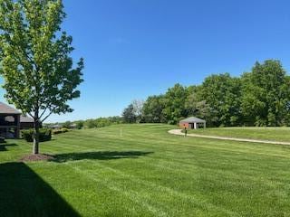 surrounding community featuring a yard