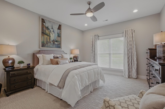 bedroom featuring light colored carpet, recessed lighting, and a ceiling fan