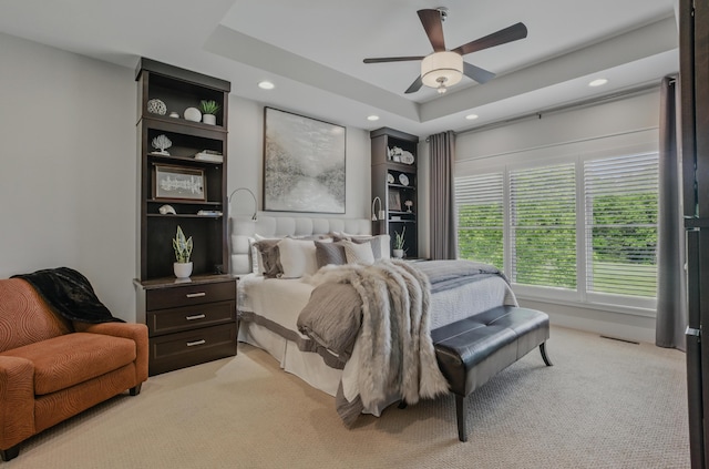 bedroom with recessed lighting, light carpet, and a ceiling fan