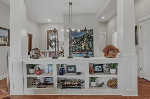 detailed view of recessed lighting and wood finished floors