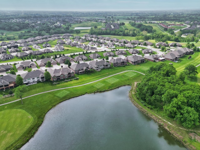 aerial overview of property's location featuring a large body of water, nearby suburban area, and a golf course