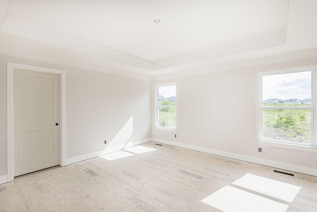 4725 Stayton Ferry Cir, Columbia, MO 65201 - spare room featuring a raised ceiling and baseboards