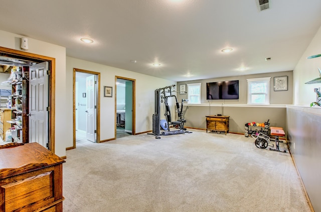 workout area featuring carpet, baseboards, and recessed lighting