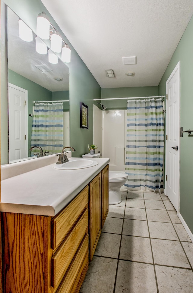 full bathroom with toilet, vanity, tile patterned floors, and curtained shower