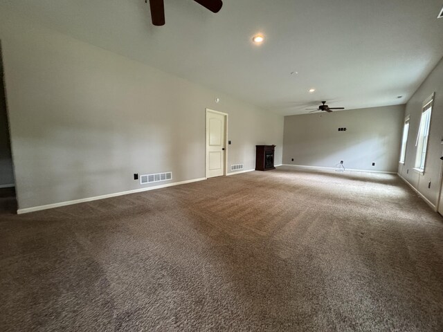 unfurnished living room featuring a ceiling fan, carpet, baseboards, and recessed lighting